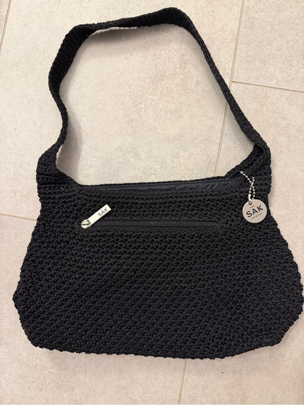 The Sak Black Crochet Shoulder Bag with Silver Charm